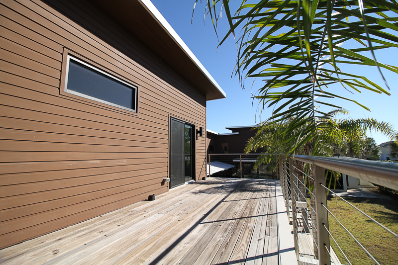 Balcony sun deck with a stainless steel cable and rail system.