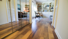 Distressed wood floors are commonly used. This floor is made from walnut with a satin finish.