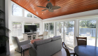 This natural wood ceiling brings out the beauty in this sun room.