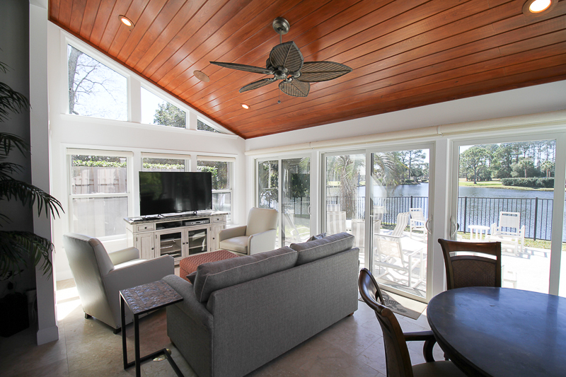This natural wood ceiling brings out the beauty in this sun room.