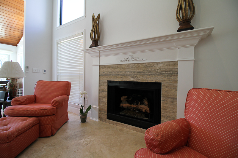 Natural stone surrounds this fireplace.