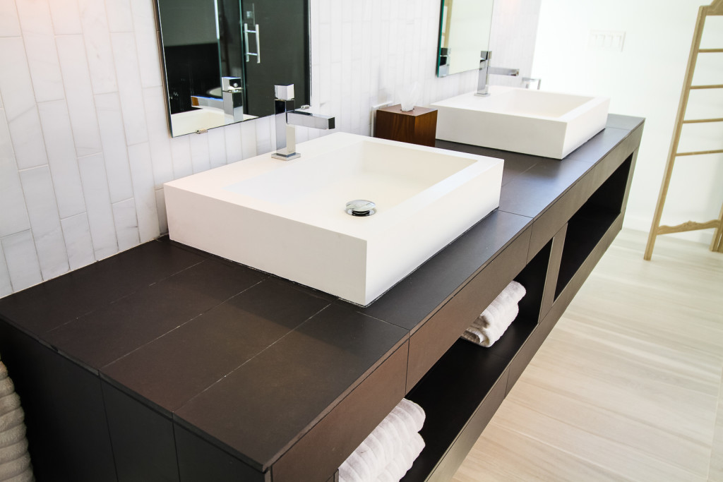 Black tile used on a custom wall hung vanity.
