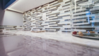 Solid surface top to look like marble shows well with the combination glass and marble backsplash.